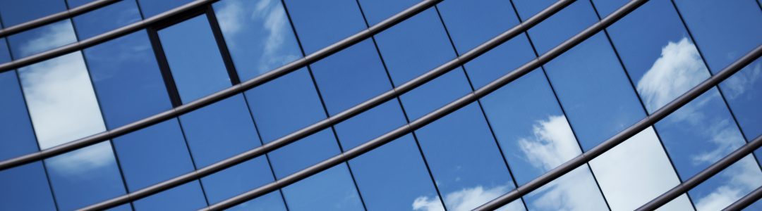 Glass facade of a modern office building in the city